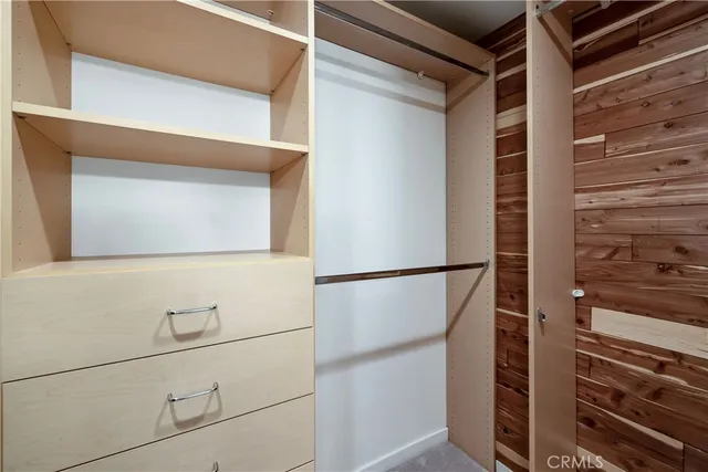 a white refrigerator freezer and a stove sitting inside of a kitchen