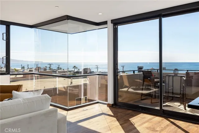 a view of a living room and floor to ceiling window