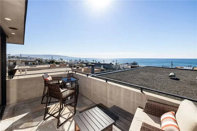 a view of a chairs and table on the terrace