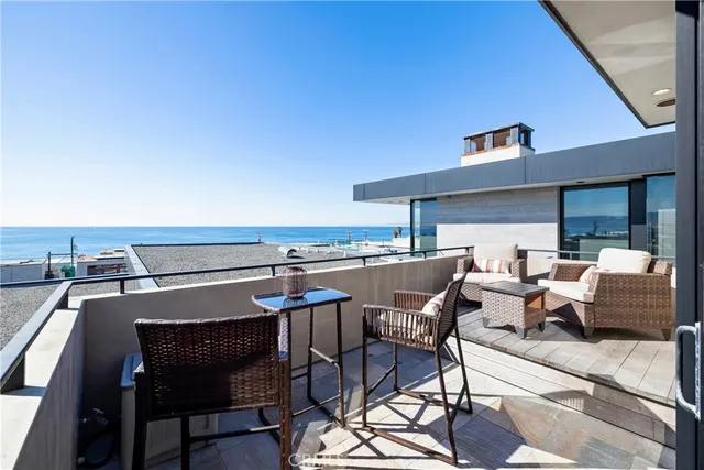 a view of a patio with table and chairs