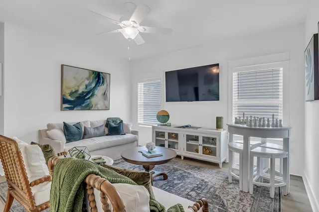 a bedroom with a bed and a lamp on dresser