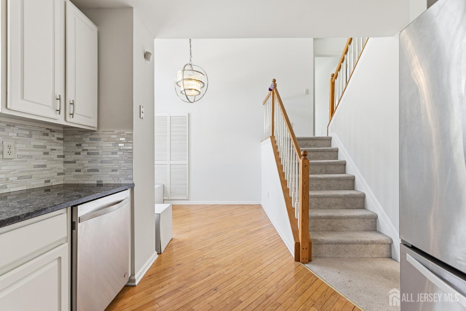 12 Rondell Lane Old Bridge, NJ 08879 - Photo 12 of 34 a view of hallway with stairs and wooden floor