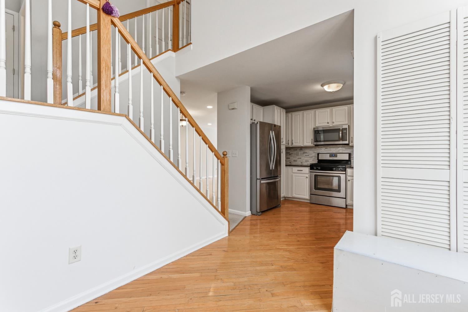 12 Rondell Lane Old Bridge, NJ 08879 - Photo 14 of 34 a view of a kitchen with wooden floor and electronic appliances