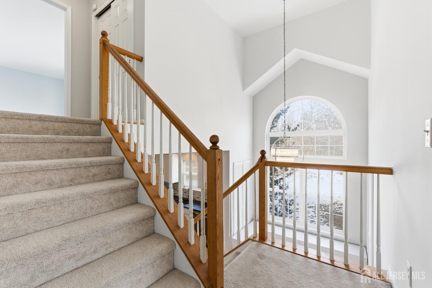 12 Rondell Lane Old Bridge, NJ 08879 - Photo 16 of 34 a view of staircase with lots of frames on wall and a window