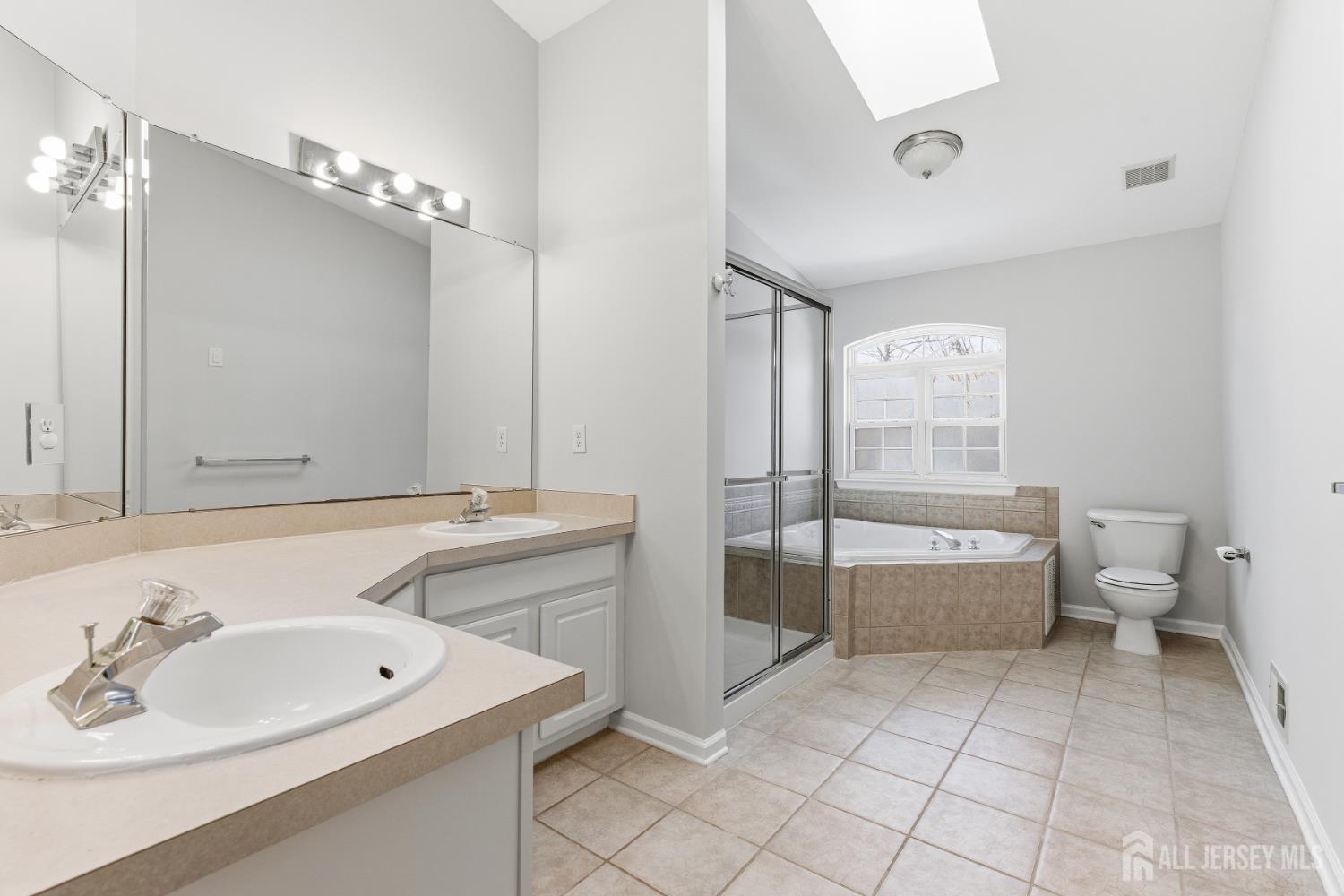 12 Rondell Lane Old Bridge, NJ 08879 - Photo 19 of 34 a bathroom with a toilet sink and mirror