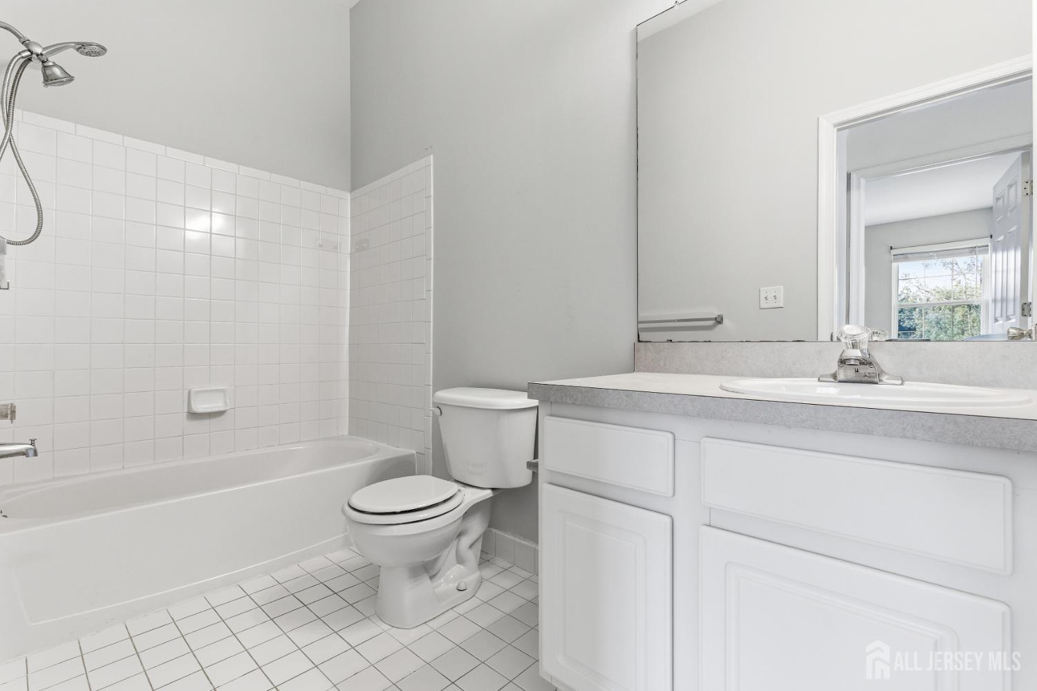 12 Rondell Lane Old Bridge, NJ 08879 - Photo 28 of 34 a bathroom with a sink a toilet and a large mirror