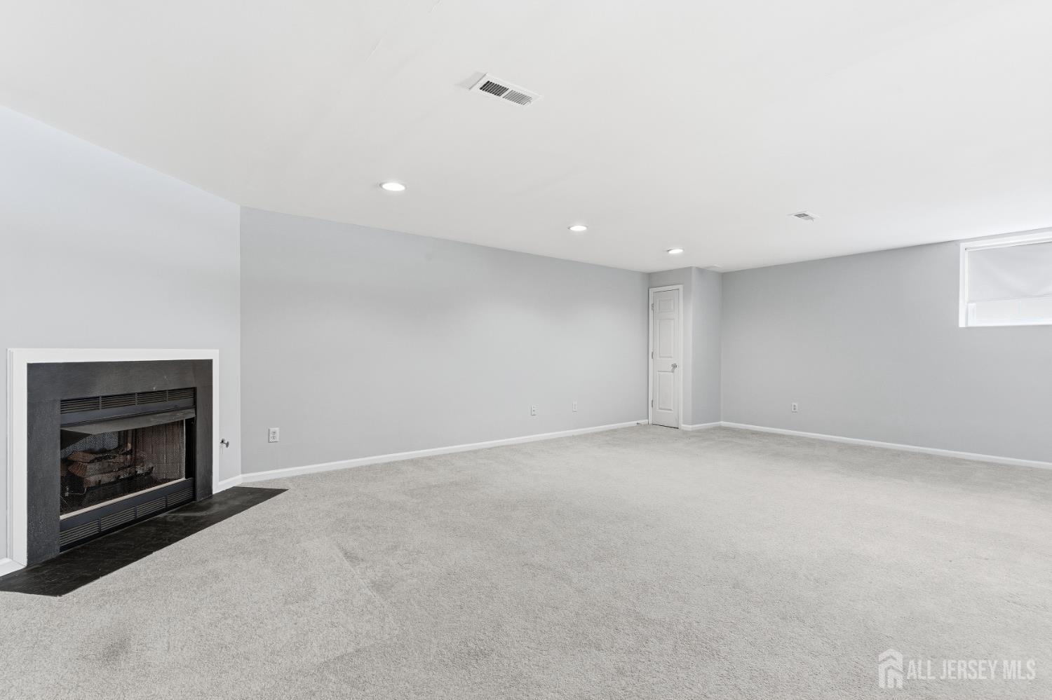12 Rondell Lane Old Bridge, NJ 08879 - Photo 29 of 34 a view of an empty room with a fireplace