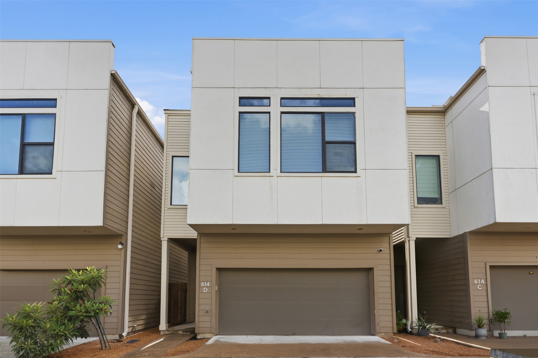 Privately positioned with no directly adjoining neighbors, complemented by an attached two-car garage.