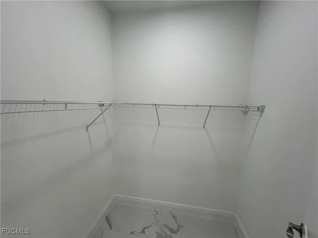 a view of a room with racks on the wall