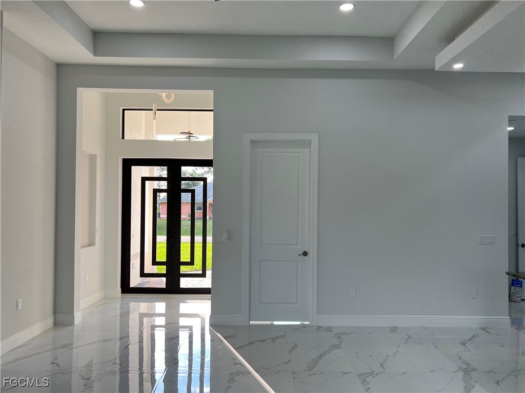 1010 Angelo Avenue Lehigh Acres, FL 33971 - Photo 4 of 34 a view of an entryway of a house