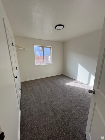 1696 South Longview Road Santaquin, UT 84655 - Photo 9 of 16 Unfurnished bedroom featuring baseboards and carpet flooring