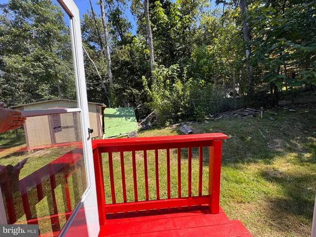 a front view of a house with a wooden fence