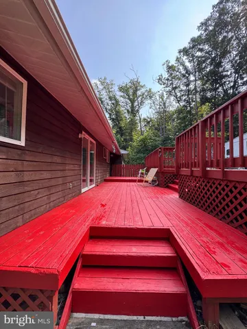 a view of a backyard with a deck