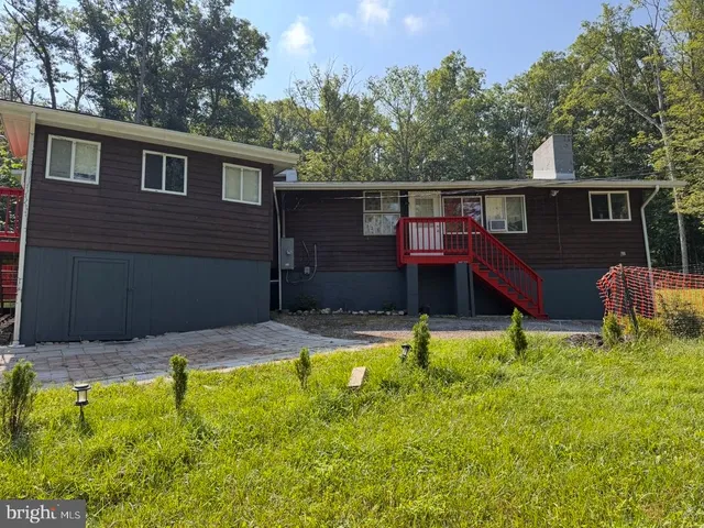 a view of a wooden deck with a bench