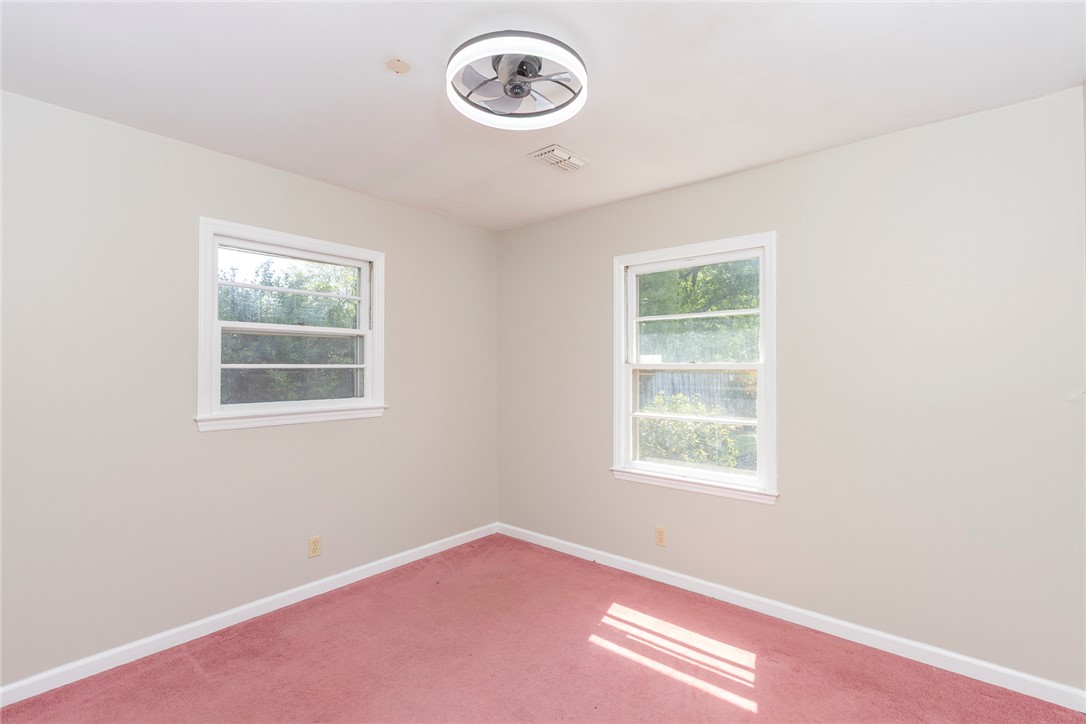 820 Travis Road Anderson, SC 29626 - Photo 28 of 46 This bright room features abundant natural light and carpet flooring.