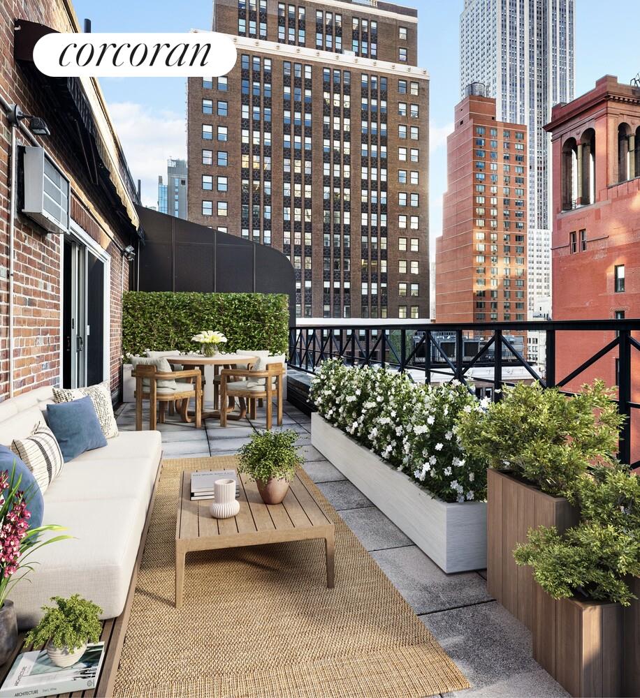 a view of a patio with couches table and chairs and potted plants