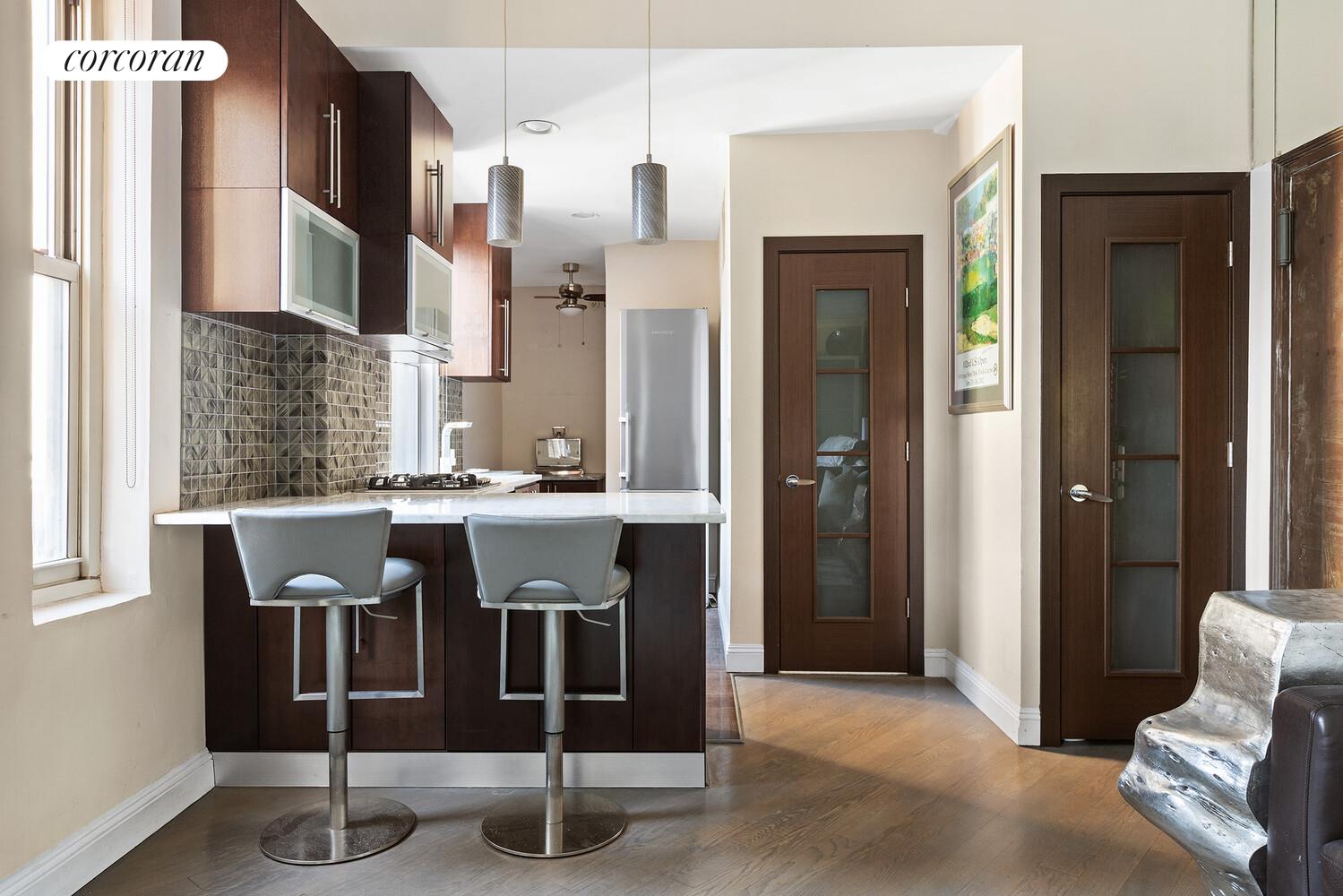 220 Madison Avenue, Unit PHC Manhattan, NY 10016 - Photo 10 of 15 a view of kitchen with seating area