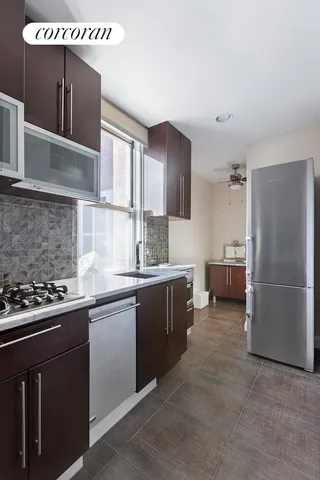 a kitchen with a sink cabinets and appliances