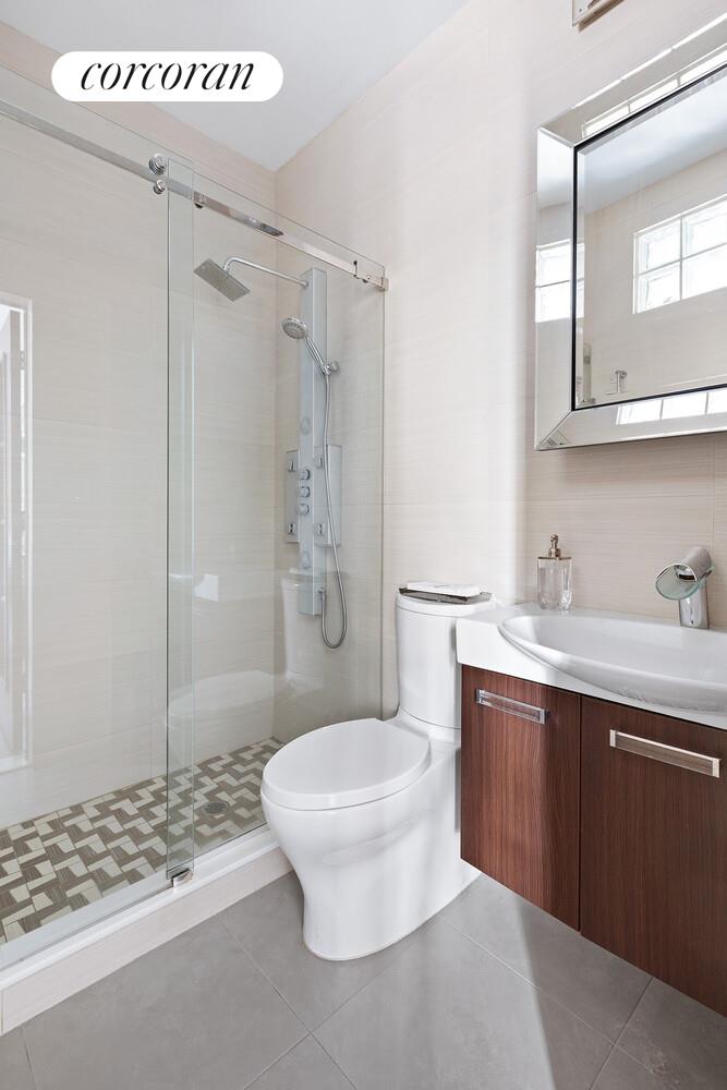 220 Madison Avenue, Unit PHC Manhattan, NY 10016 - Photo 13 of 15 a bathroom with a sink a toilet and shower