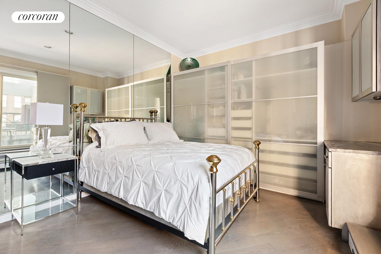 220 Madison Avenue, Unit PHC Manhattan, NY 10016 - Photo 9 of 15 a bedroom with a bed table and chair