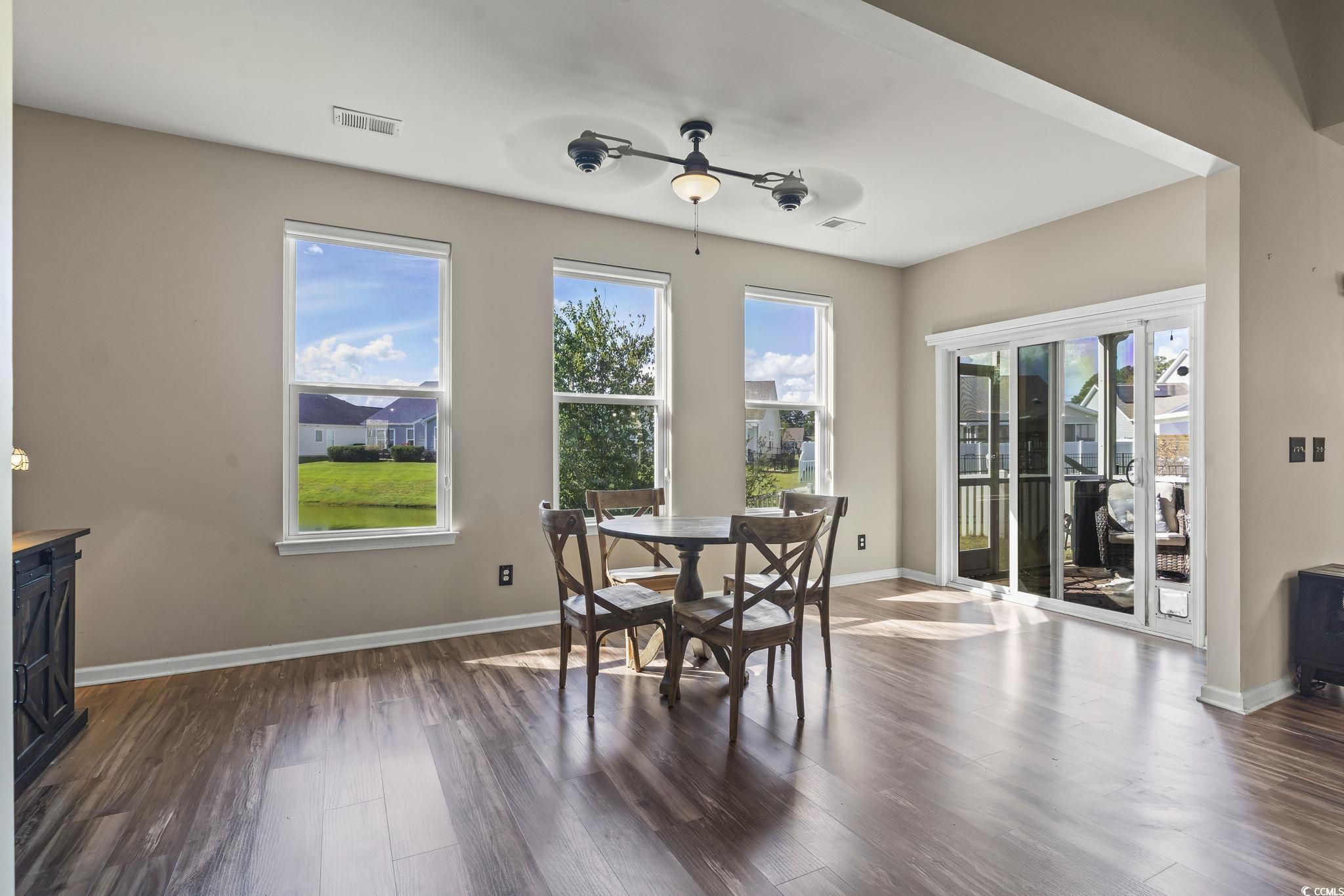 256 Copper Leaf Drive Myrtle Beach, SC 29588 - Photo 10 of 40 Dining space featuring dark wood-type flooring and baseboards