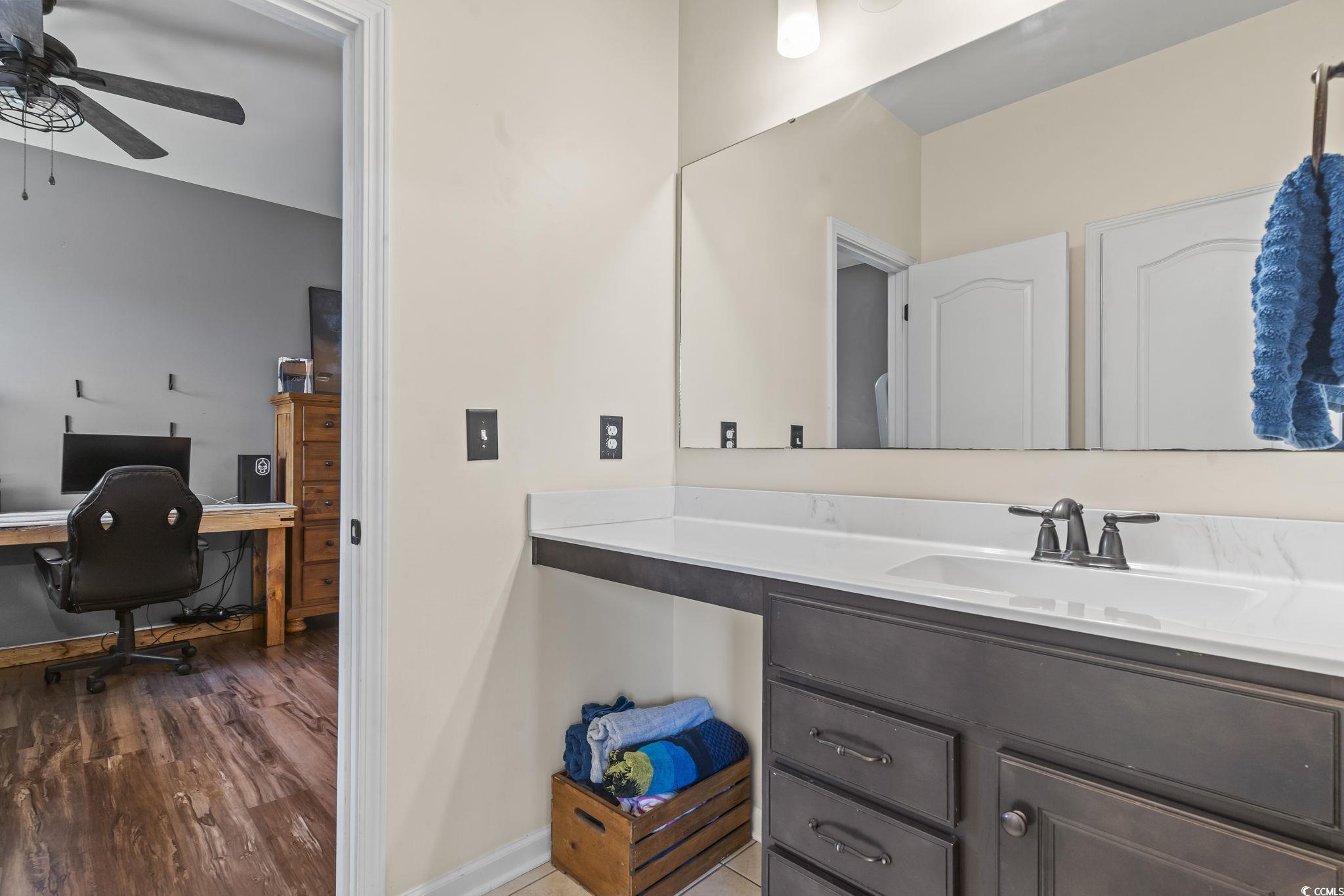 256 Copper Leaf Drive Myrtle Beach, SC 29588 - Photo 19 of 40 Bathroom featuring vanity, ceiling fan, and wood finished floors