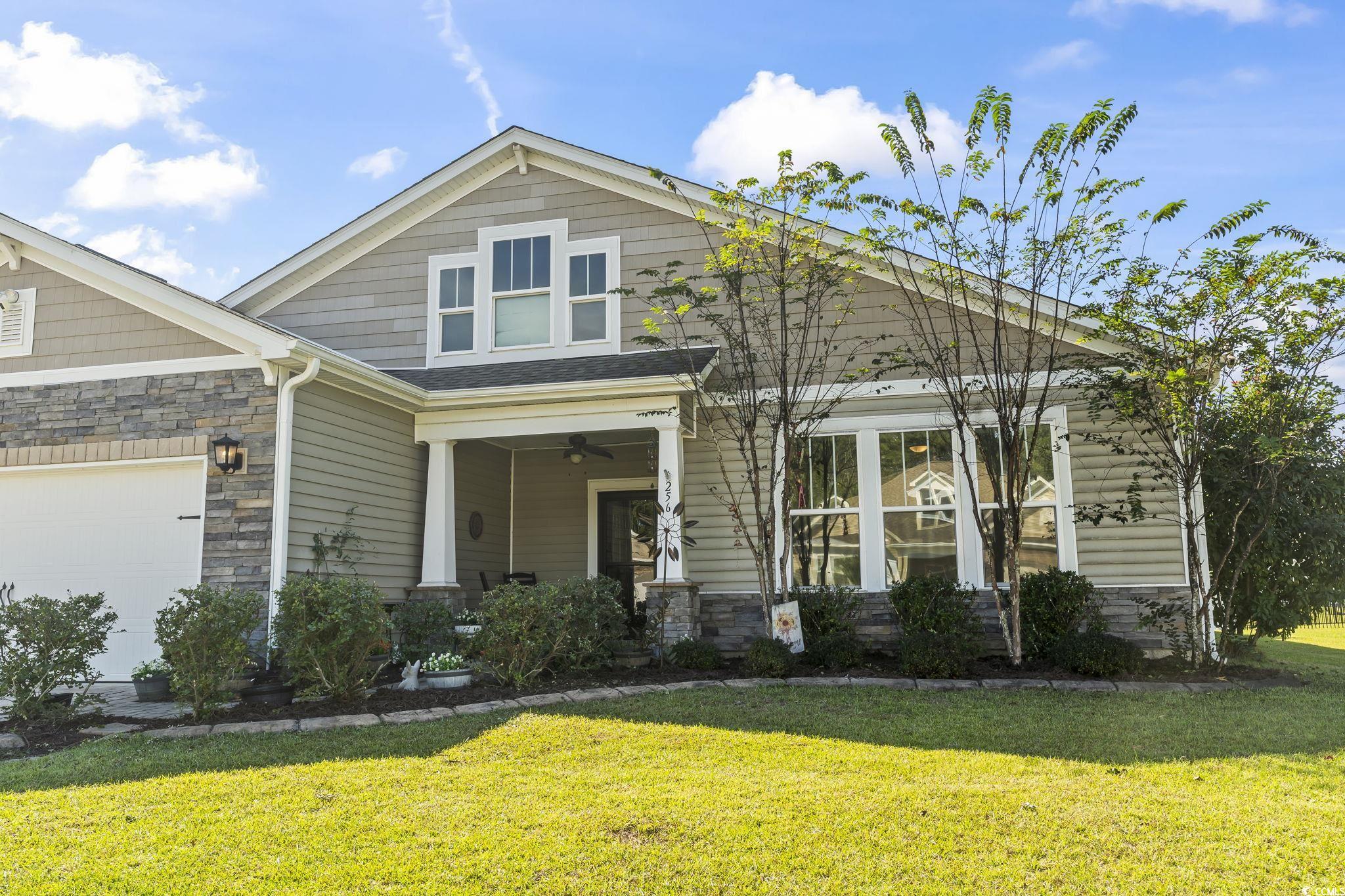 256 Copper Leaf Drive Myrtle Beach, SC 29588 - Photo 27 of 40 Craftsman inspired home featuring stone siding, a front yard, and covered porch