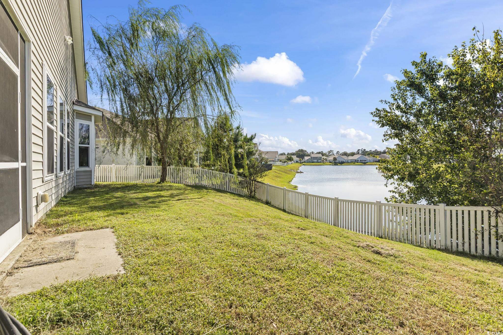 256 Copper Leaf Drive Myrtle Beach, SC 29588 - Photo 28 of 40 Fenced backyard with a water view and a residential view