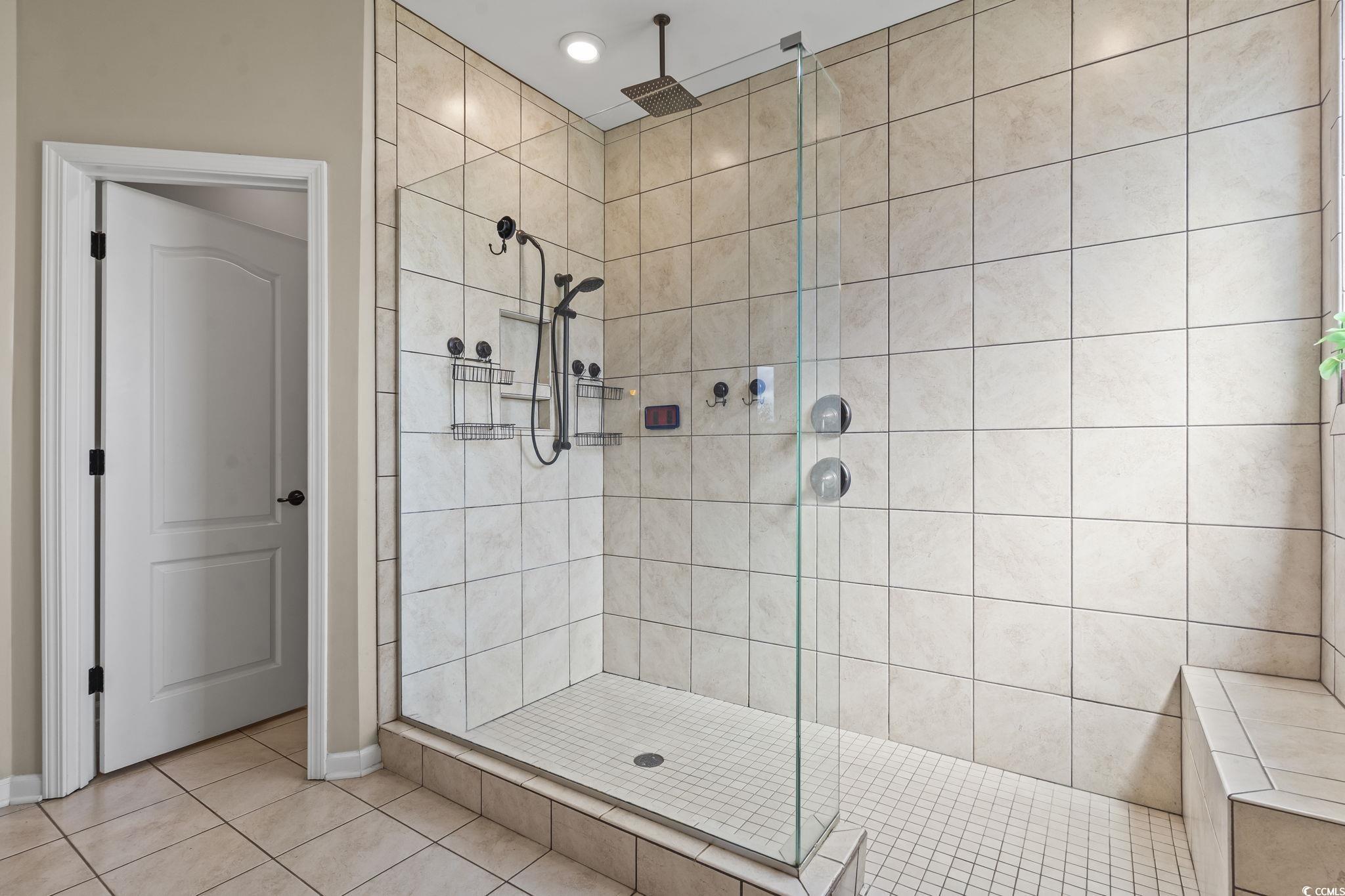 256 Copper Leaf Drive Myrtle Beach, SC 29588 - Photo 3 of 40 Bathroom featuring a shower stall and tile patterned flooring