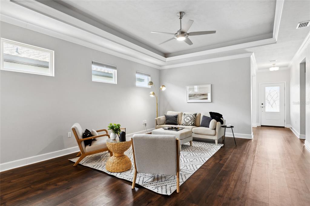 9641 Southwest 67th Drive Gainesville, FL 32608 - Photo 4 of 32 a living room with furniture and wooden floor