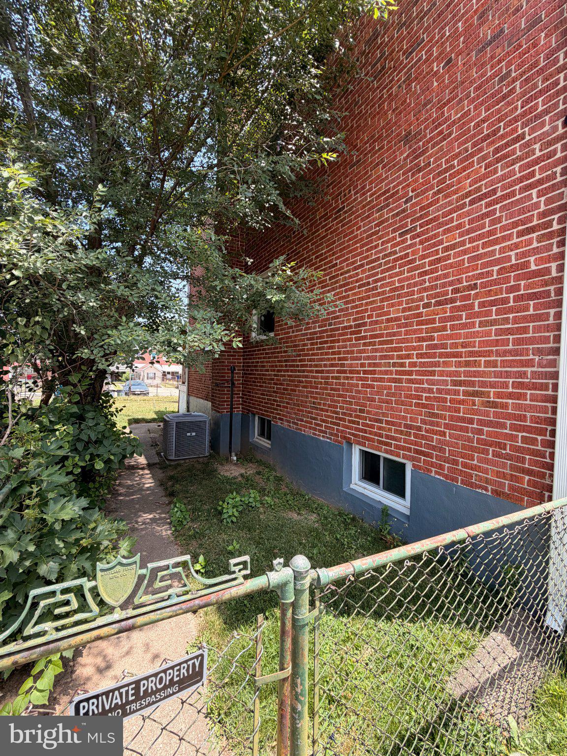 2717 Creston Road Dundalk, MD 21222 - Photo 2 of 22 Charming brick facade with greenery.