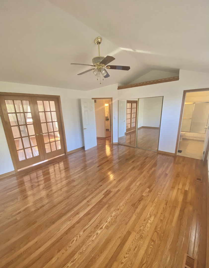 68 White Oaks Road Matteson, IL 60443 - Photo 24 of 39 a view of an empty room with wooden floor and a window