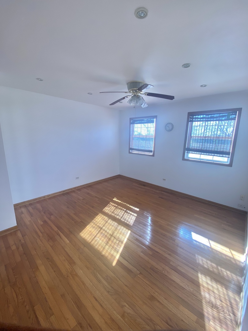 68 White Oaks Road Matteson, IL 60443 - Photo 27 of 39 wooden floor in an empty room with a window