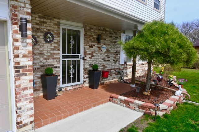 68 White Oaks Road Matteson, IL 60443 - Photo 10 of 39 a view of a patio with table and chairs potted plants and floor to ceiling window