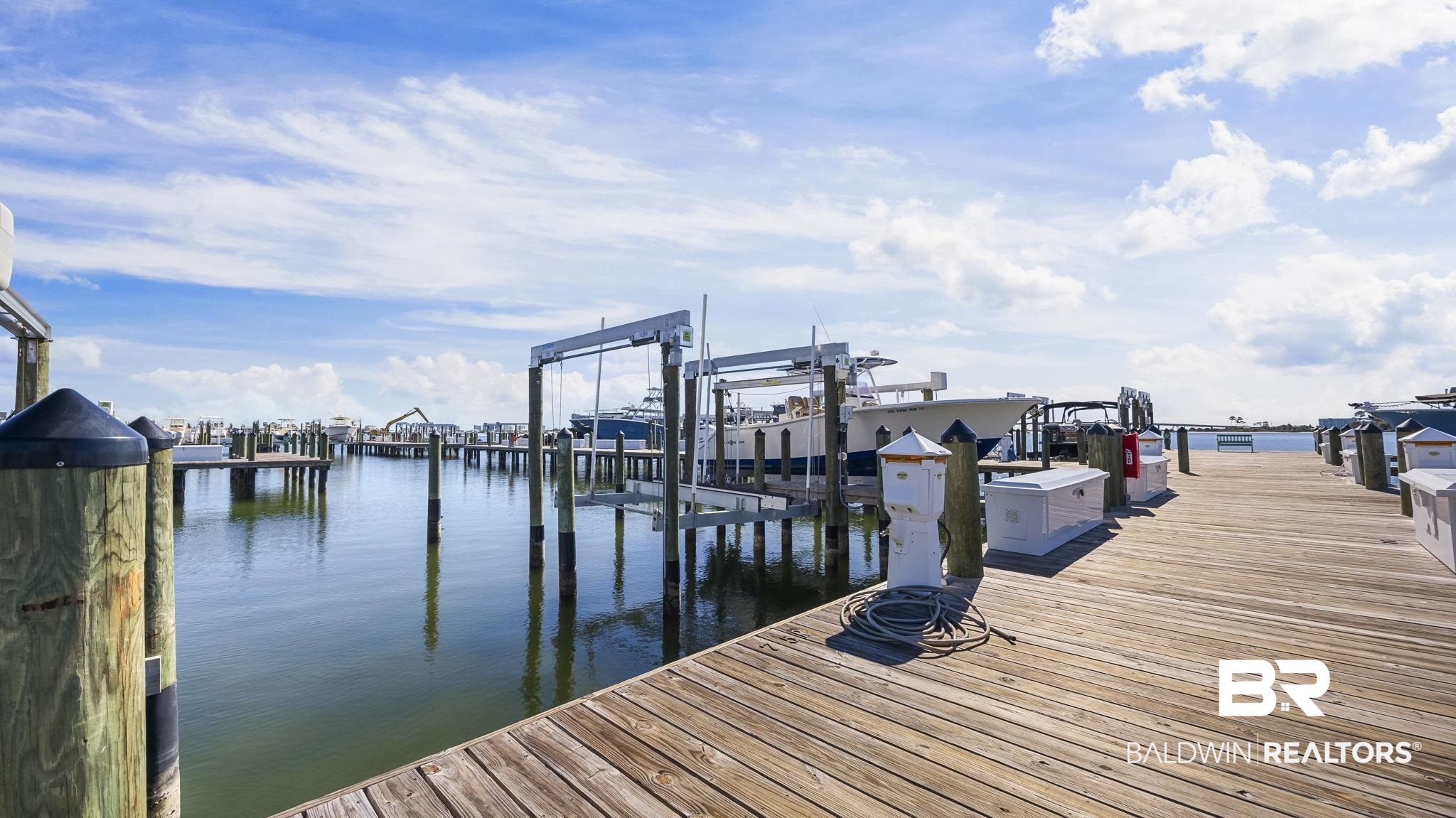 27580 Canal Road, Unit 1526 Orange Beach, AL 36561 - Photo 30 of 49 Dock area featuring boat lift and a water view
