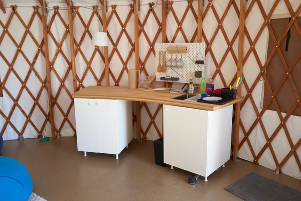 a utility room with a sink and cabinets