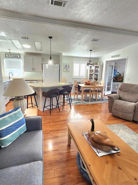 6513 Oregon Street Bradenton, FL 34207 - Photo 16 of 57 a living room with furniture and wooden floor