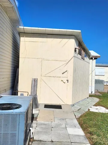 a swimming pool with outdoor seating and yard