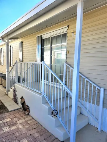 a view of a balcony with a chair