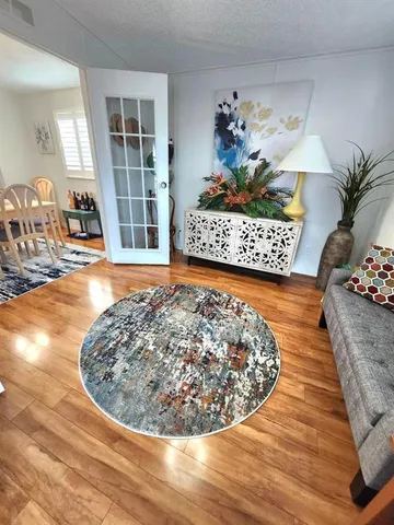 a view of living room with furniture and flowers