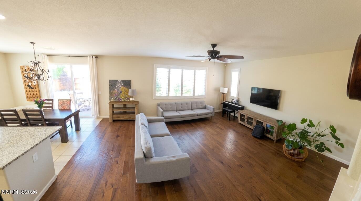 2775 Bonfire Lane Reno, NV 89521 - Photo 9 of 41 a living room with furniture and a flat screen tv