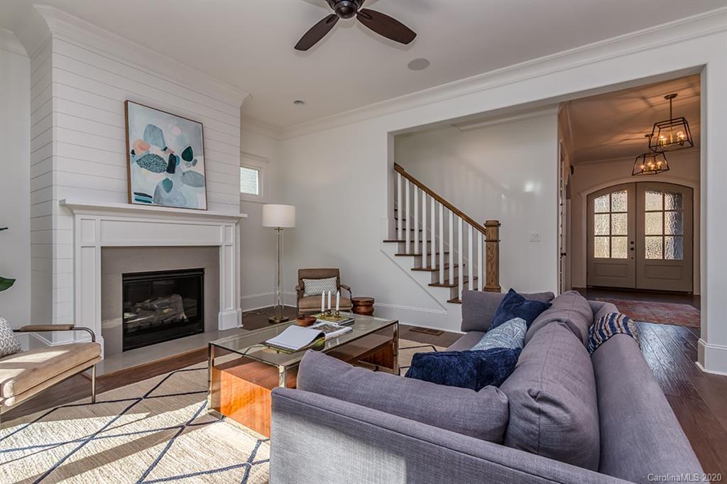 744 Ellsworth Road, Unit 46 Charlotte, NC 28211 - Photo 17 of 31 a living room with furniture fireplace and a window