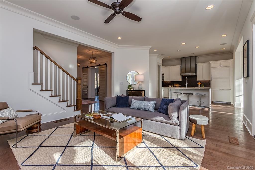 744 Ellsworth Road, Unit 46 Charlotte, NC 28211 - Photo 18 of 31 a living room with fireplace furniture and a wooden floor