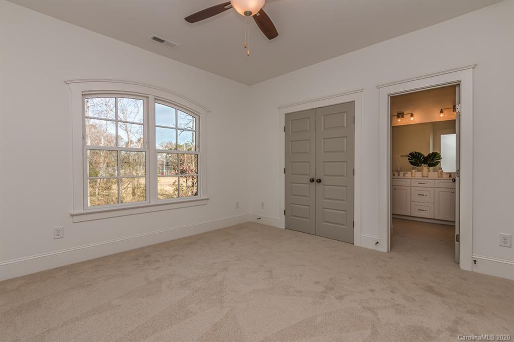 744 Ellsworth Road, Unit 46 Charlotte, NC 28211 - Photo 19 of 31 an empty room with windows and closet