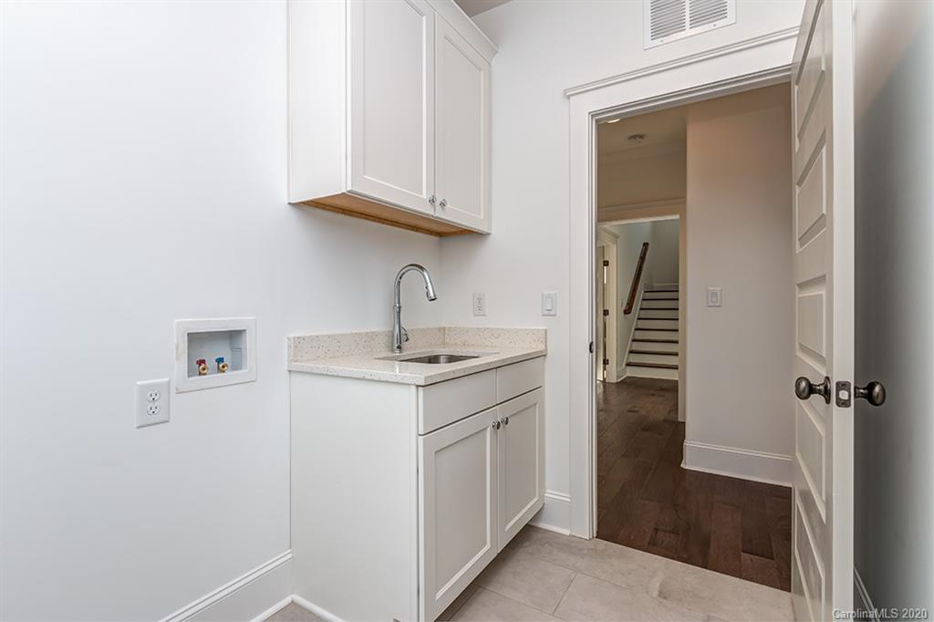 744 Ellsworth Road, Unit 46 Charlotte, NC 28211 - Photo 26 of 31 a kitchen with a sink and cabinets