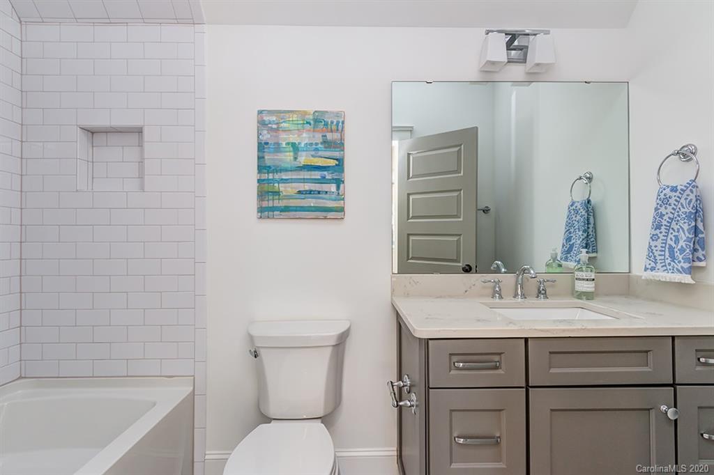744 Ellsworth Road, Unit 46 Charlotte, NC 28211 - Photo 28 of 31 a bathroom with a sink toilet vanity and bathtub