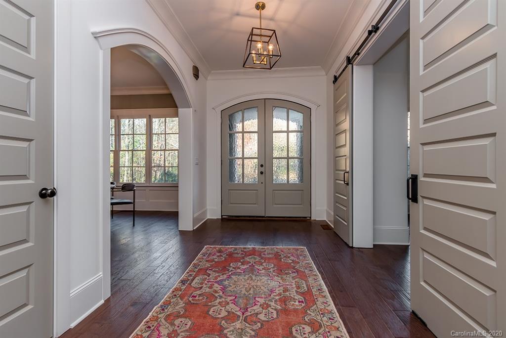 744 Ellsworth Road, Unit 46 Charlotte, NC 28211 - Photo 4 of 31 a view of a hallway with entryway and wooden floor