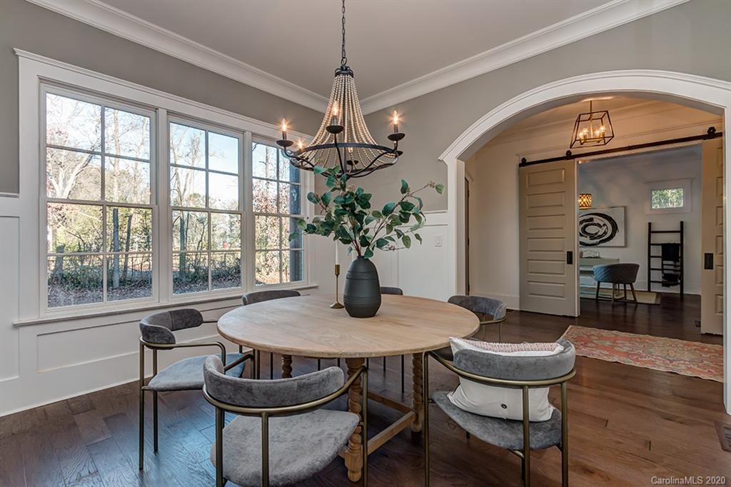 744 Ellsworth Road, Unit 46 Charlotte, NC 28211 - Photo 6 of 31 a view of a dining room with furniture window and wooden floor
