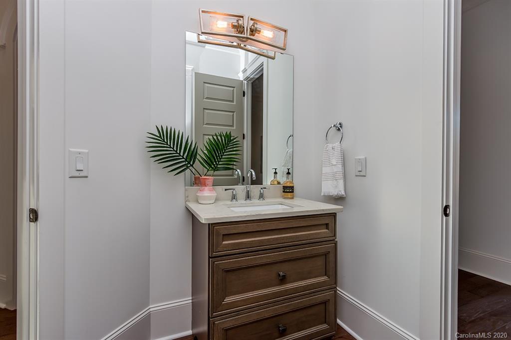 744 Ellsworth Road, Unit 46 Charlotte, NC 28211 - Photo 8 of 31 a bathroom with a sink and a mirror