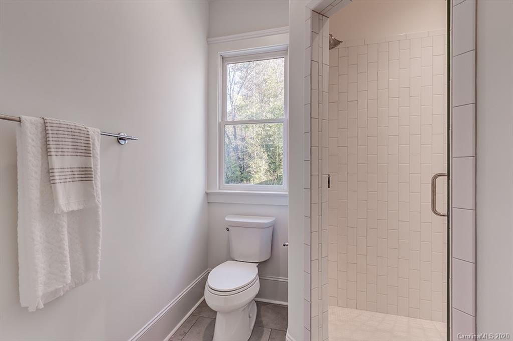 744 Ellsworth Road, Unit 46 Charlotte, NC 28211 - Photo 9 of 31 a a bathroom view of a toilet and a shower